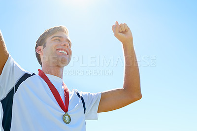 Buy stock photo Cropped view of a sportsman celebrating his medal