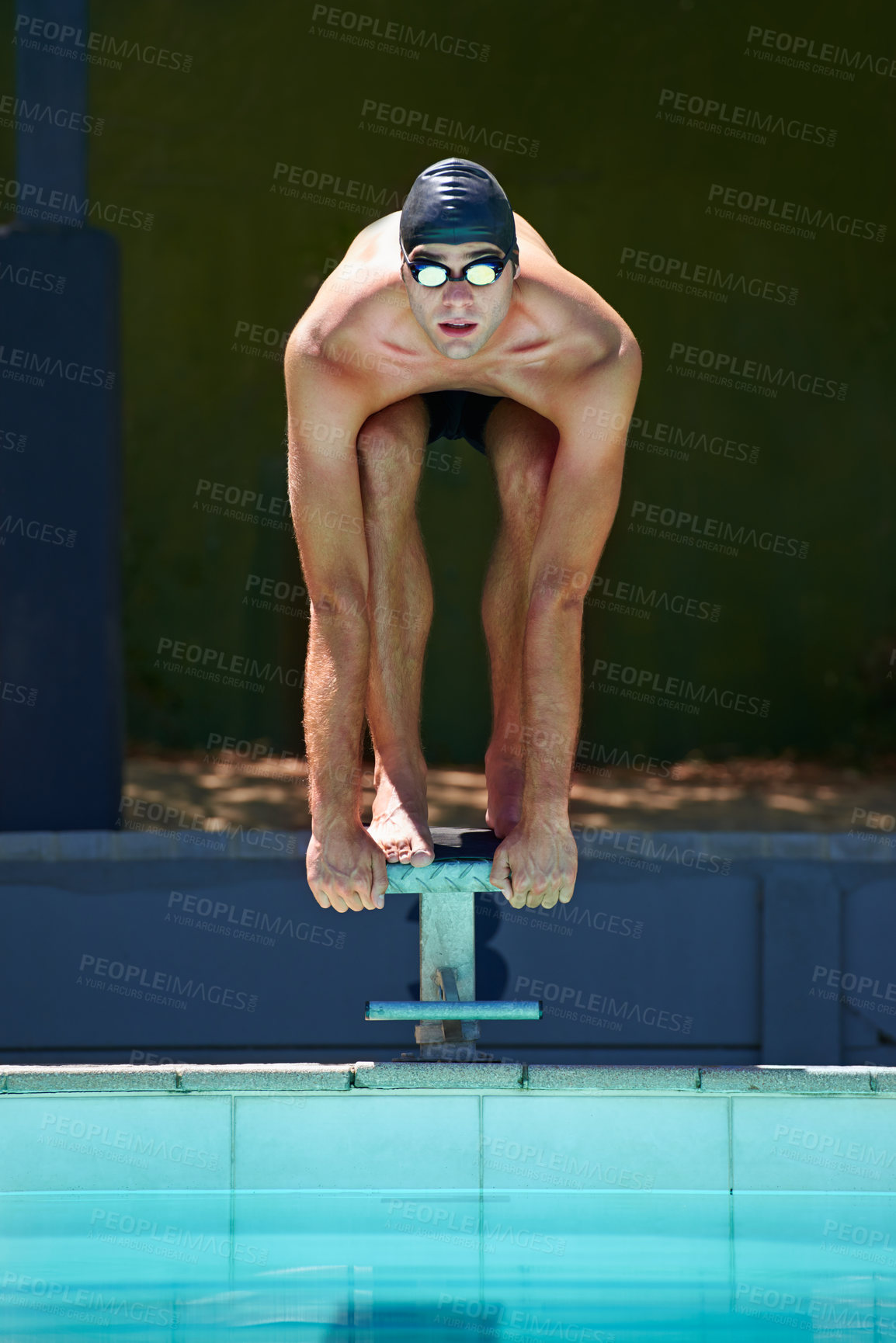 Buy stock photo Swimming, sports and man on start block, platform or podium for outdoor fitness exercise, practice or race. Training, athlete and swimmer ready for competition, cardio performance or contest