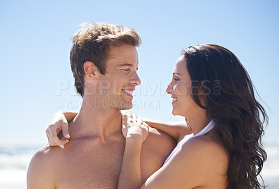 Buy stock photo Embrace, blue sky and happy couple on beach for tropical island holiday adventure together with water, love and nature. Smile, man and woman on ocean vacation with hug, romance and travel in Hawaii.