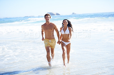Buy stock photo Portrait, summer and couple running in water at beach together for love, travel or romance outdoor. Earth, nature or waves with man and woman holding hands in ocean or sea for holiday and vacation