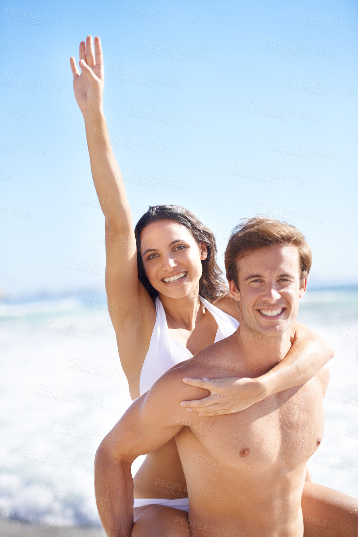 Buy stock photo Portrait, energy and piggyback with couple on beach together for holiday, vacation or romantic getaway. Smile, travel or love with happy young man and woman by ocean or sea for coastal adventure