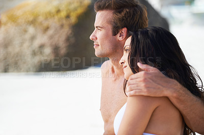 Buy stock photo Love, summer and hug with couple on beach together for travel, vacation or holiday to relax on coast. Face, space or vision with young man and woman on sand by sea or ocean for romance and bonding