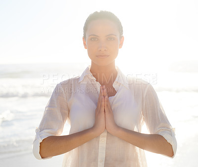 Buy stock photo Portrait, yoga and meditation with woman on beach at sunset for wellness, balance or inner peace. Summer, nature and zen with serious young person by sea or ocean for health, awareness or mindfulness