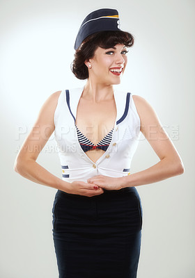 Buy stock photo Travel, flight attendant and portrait of happy woman in studio isolated on a white background in Spain. Fashion, air hostess and smile of retro sailor person, pin up girl or stewardess model in hat