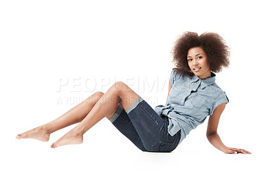 Buy stock photo African woman, denim fashion and portrait on studio floor with casual style and sitting. Isolated, white background and female person with body confidence and modern clothes sitting on the ground