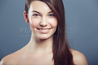 Buy stock photo Face, skin and beauty portrait of a woman in studio with natural makeup, smile and cosmetics. Happy aesthetic gen z female model on a grey background for glow, hair care and facial dermatology shine 