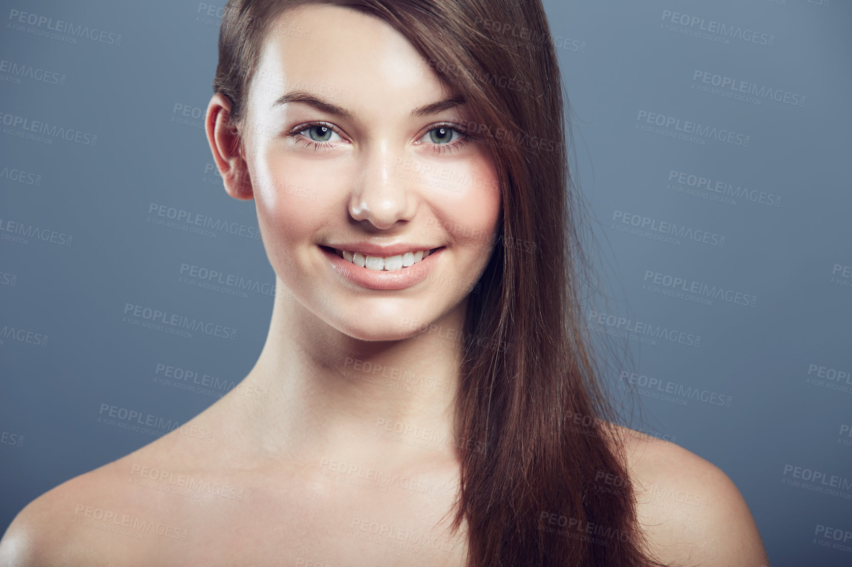 Buy stock photo Face, skin and beauty portrait of a woman in studio with natural makeup, smile and cosmetics. Happy aesthetic gen z female model on a grey background for glow, hair care and facial dermatology shine 