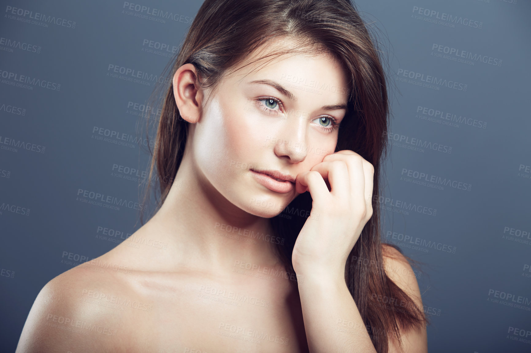 Buy stock photo Face, beauty and portrait of a innocent woman in studio with a glow, makeup and cosmetics. Headshot of aesthetic female model on a grey background for natural shine, hair care and facial dermatology