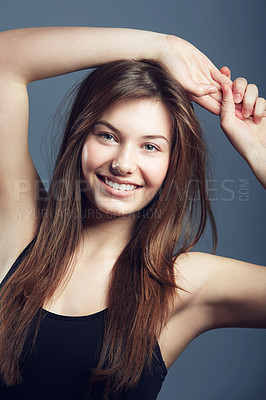 Buy stock photo Portrait, hair and natural beauty of woman in studio isolated on a blue background. Face, skincare and cosmetics of happy model at spa for facial treatment, wellness or health for glow of hairstyle