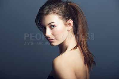 Buy stock photo Portrait of a beautiful young woman looking at the camera