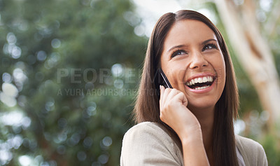 Buy stock photo A pretty young woman enjoying a conversation in the park