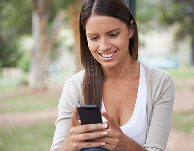 Buy stock photo Woman, cellphone and texting outdoor or message online, connection or internet. Female person, digital device and nature for relax chat or typing web browsing or social media, communication or scroll