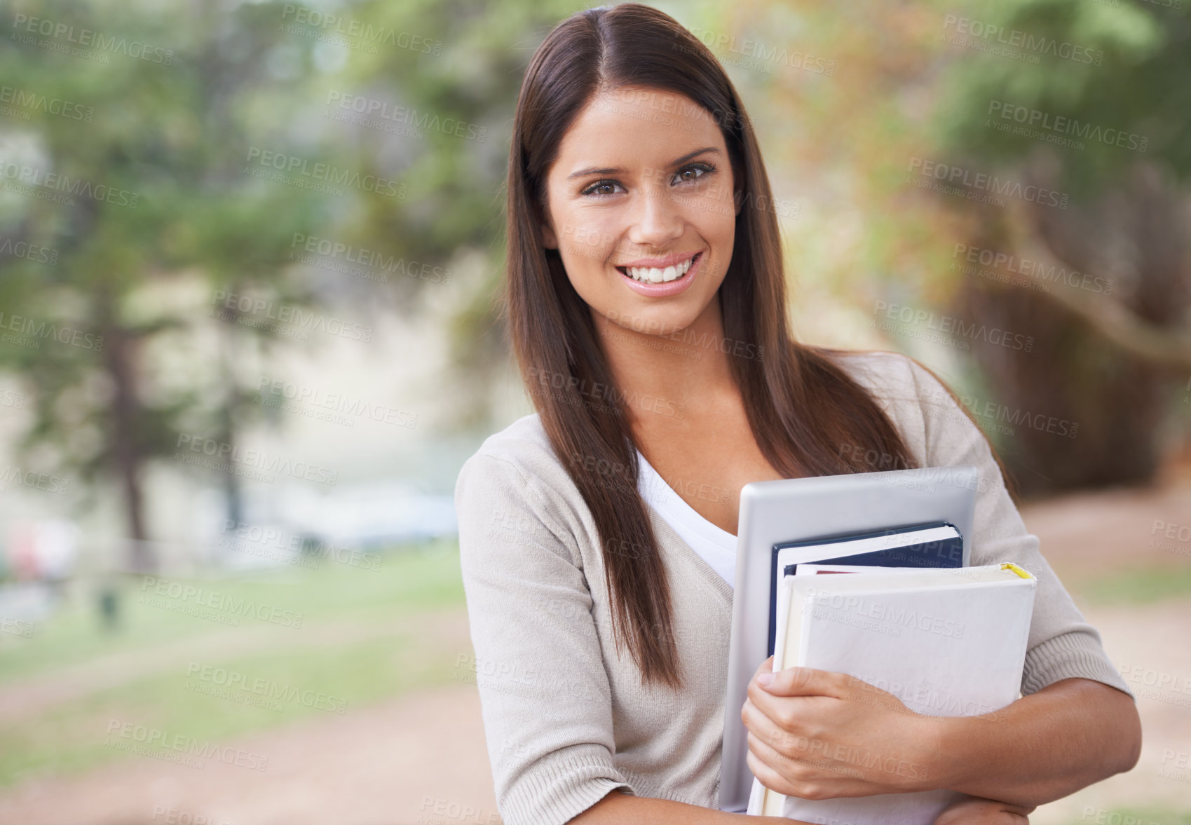 Buy stock photo Student, portrait and books with smile in outdoor nature, technology and education in learning for studying. University, young woman and face for phd research, park and commitment for scholarship