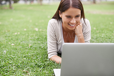 Buy stock photo College student, studying and woman with laptop in park on campus with research, project and education. University, person and reading on computer outdoor on lawn, grass or garden with happiness