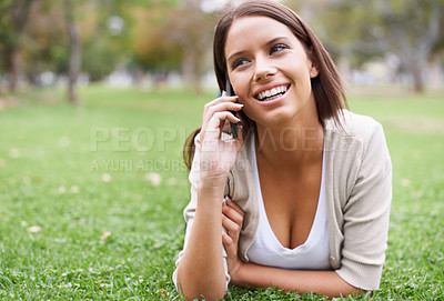 Buy stock photo Woman, phone call and relax on grass conversation or communication, good news or gossip. Female person, smile and digital device in nature park for holiday rest or speaking chat, advice or connection