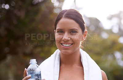 Buy stock photo Portrait, fitness or water bottle with a happy woman or athlete standing outside with a towel in exercise. Training, running or outdoor workout with a smile or runner in park for cardio or energy
