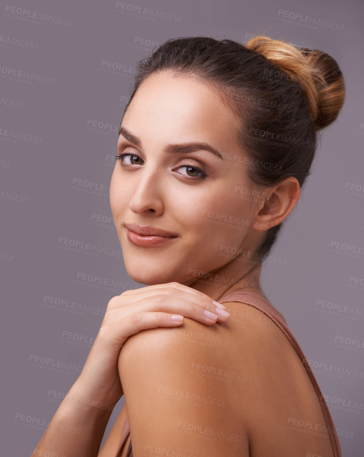 Buy stock photo An attractive young woman against a purple background