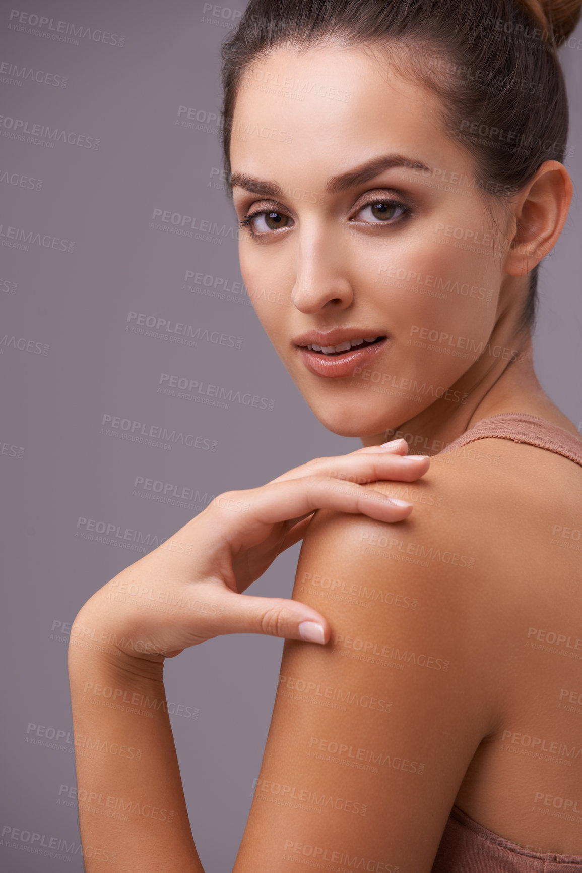 Buy stock photo An attractive young woman against a purple background