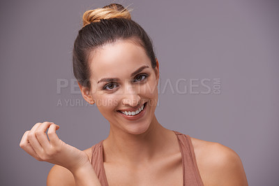 Buy stock photo Skincare, portrait and young woman in a studio with health, wellness and dermatology routine. Cosmetic, confident and female person with natural facial beauty treatment isolated by gray background.