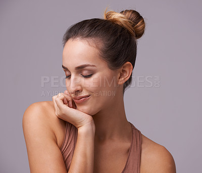 Buy stock photo Skincare, beauty and young woman in a studio with health, wellness and dermatology routine. Cosmetic, confident and happy female person with natural facial treatment isolated by gray background