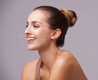 Buy stock photo An attractive young woman against a purple background