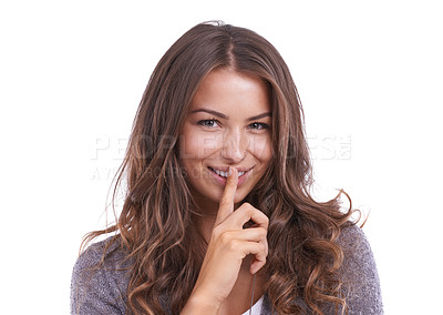 Buy stock photo Happy woman, portrait and secret for gossip, confidential information or whisper on a white studio background. Face of female person, brunette or model smile with finger on lips for silence on mockup