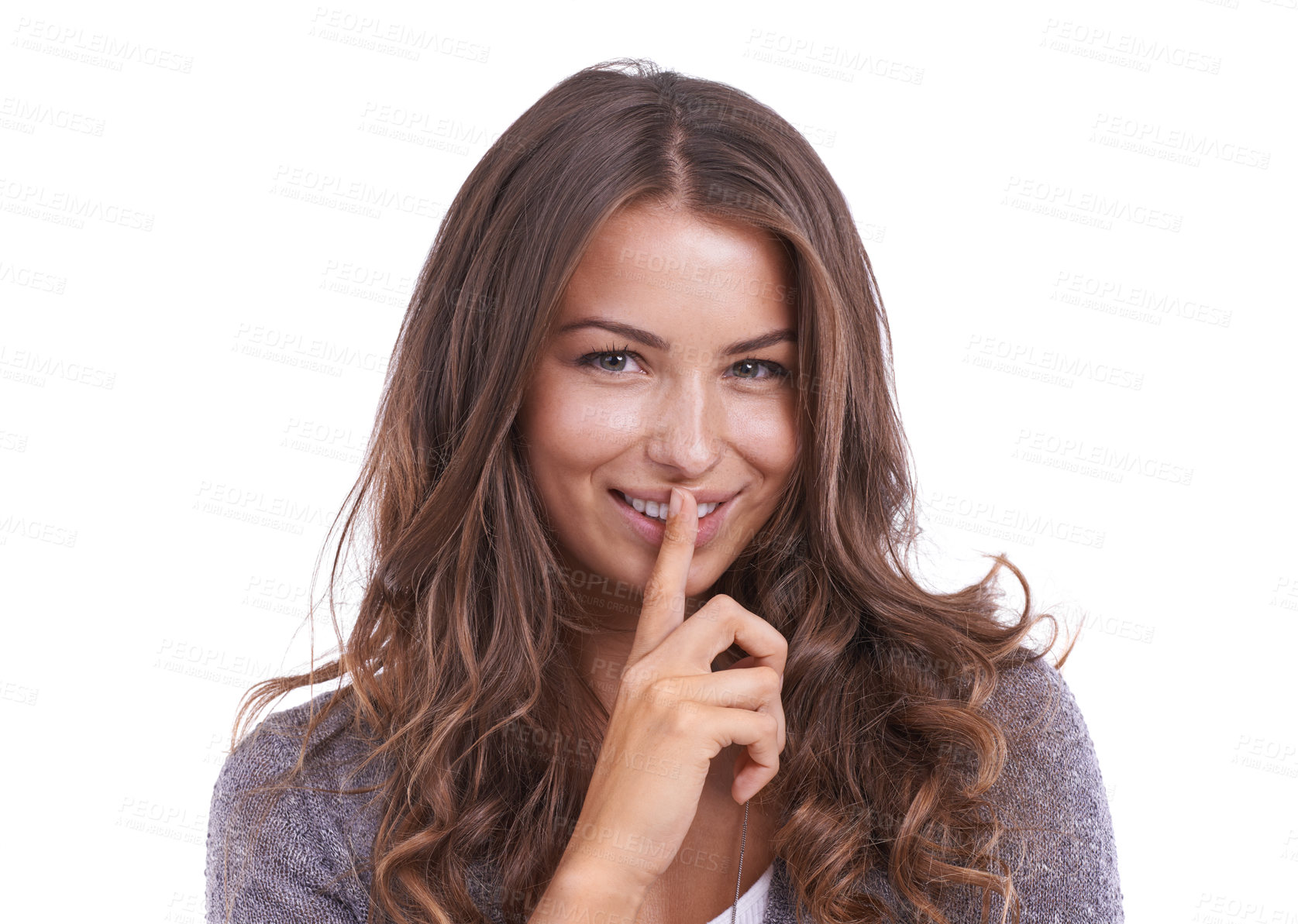 Buy stock photo Happy woman, portrait and secret for gossip, confidential information or whisper on a white studio background. Face of female person, brunette or model smile with finger on lips for silence on mockup