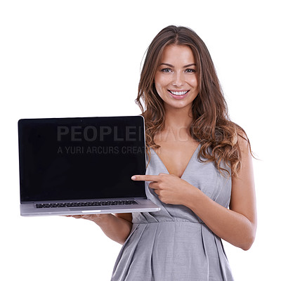 Buy stock photo Portrait, woman and pointing in studio to laptop screen for advertising deal, promotion and newsletter on white background. Happy model, computer and presentation of mockup space, feedback and review