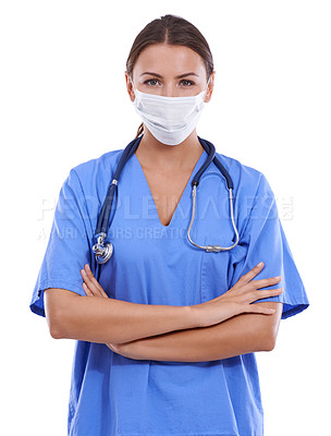 Buy stock photo A young surgeon wearing scrubs and a surgical mask looking at the camera