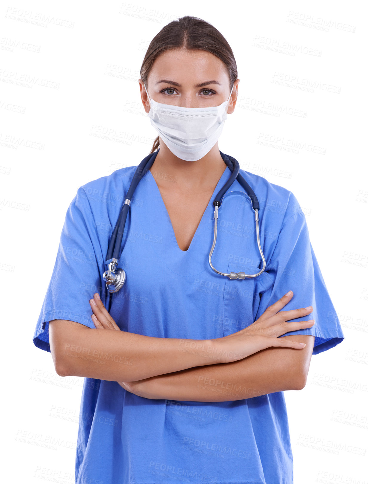 Buy stock photo A young surgeon wearing scrubs and a surgical mask looking at the camera