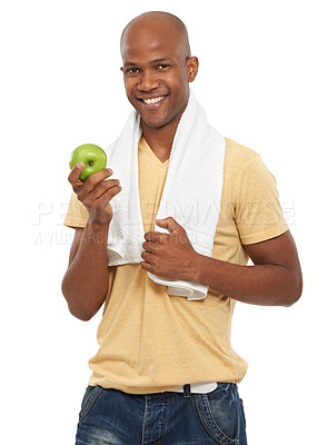 Buy stock photo Shot of an attractive ethnic man with a towel around his neck holding an apple