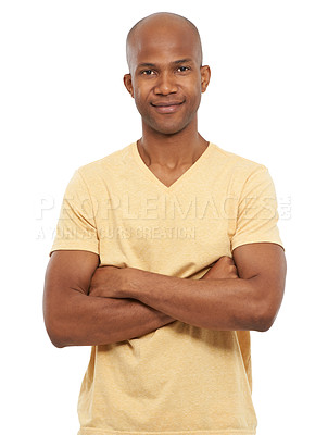Buy stock photo Studio portrait of a casual African man standing confidently with his arms crossed