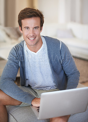 Buy stock photo Man, laptop and portrait in home living room, smile and typing for search, app or web blog on sofa. Person, computer and happy for internet connection, social media or relax on couch, lounge or house