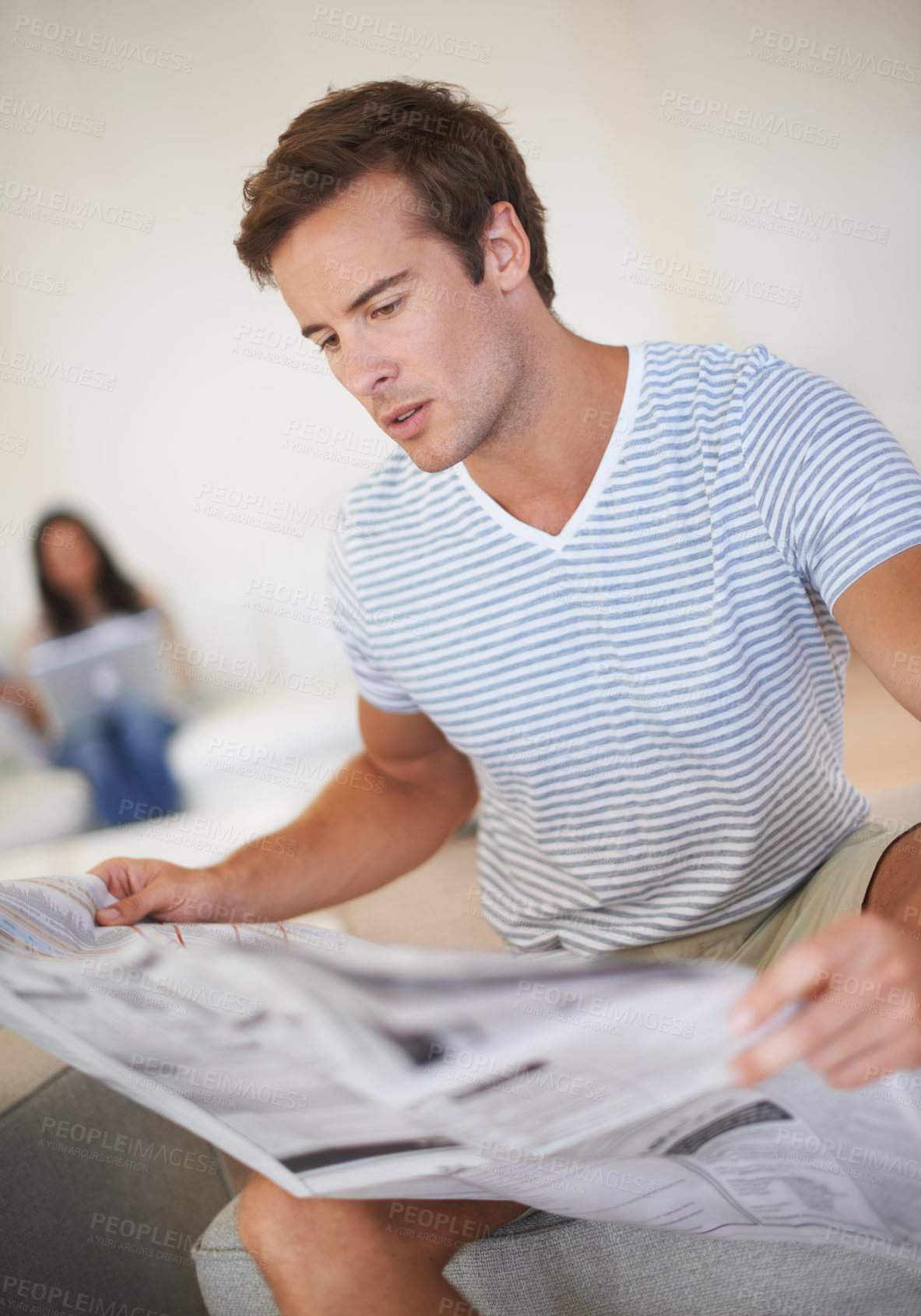 Buy stock photo Man, reading and newspaper for morning information at home for global events, knowledge or politics. Male person, couch and print media discussion or worldwide crisis problem, international or report