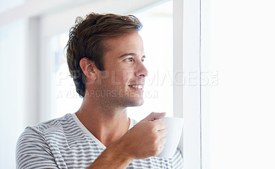 Buy stock photo Man, coffee and thinking by window in morning with smile, vision or idea with drink, choice and remember in home. Person, tea cup and happy with view for memory, decision or relax on holiday in house