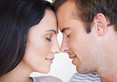 Buy stock photo Couple, forehead touch and bonding together for love, loyalty and commitment or security in marriage. People, romance and affection in apartment, support and connection in relationship or closeup