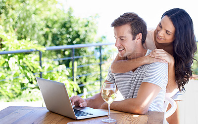 Buy stock photo Happy couple, love and outdoor by laptop on table,  champagne and positive as freelancer in typing proposal. Man, woman and smile by pc in online business, wellness and hugging entrepreneur by drink