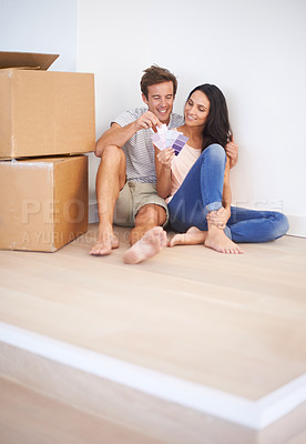 Buy stock photo Couple, color swatches and decision, new house and interior design with real estate. Property, plan renovation and people moving with boxes and investment, mortgage and palette for choice for paint