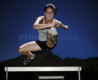 Buy stock photo Woman, portrait and hurdle jumping athlete for fitness sport practice, endurance or performance. Female person, face and leap outdoor at dark night for training health or exercise, race or workout
