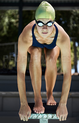 Buy stock photo A swimmer on the podium ready to dive in