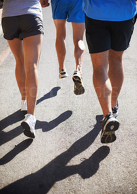 Buy stock photo People, fitness and legs running for workout, fitness or outdoor exercise together on asphalt or road. Closeup of athletic group or runners in sports training, teamwork or cardio on urban street
