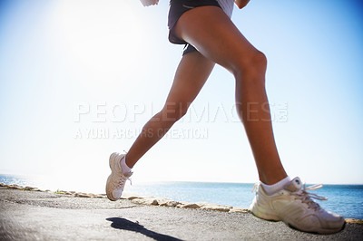 Buy stock photo Person, legs and running on road training for marathon practice for healthy cardio, competition or exercise. Athlete, sneakers and jog on street for outdoor physical commitment or speed, path or race