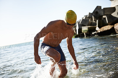 Buy stock photo Beach sports, fitness and man for swimming training, workout or exercise in sea, nature and island. Active hobby, water splash and wet swimmer for cardio, challenge or practice in outdoor Greece