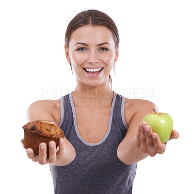 Buy stock photo Healthy food, portrait and woman with choice in hands with apple and muffin in white background of studio. Mockup, space and person balance a decision in nutrition with sweets, dessert and fruit