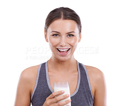 Buy stock photo Portrait of an attractive young woman holding a glass of milk