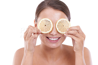 Buy stock photo Woman, lemon on eyes and beauty with skincare, cosmetics and close up, natural products and healthy skin. Facial, wellness and glowing face on white studio background, model and cosmetic dermatology