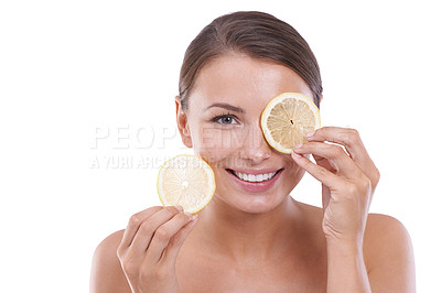 Buy stock photo Woman, lemon on eye and portrait with skincare, cosmetics and close up, natural products and healthy skin. Facial, vitamin c and glowing face on white studio background, model or cosmetic dermatology
