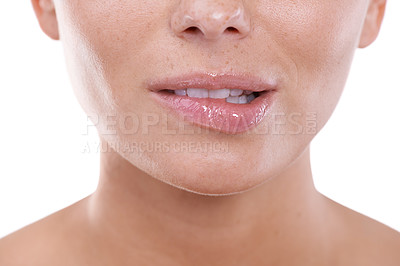 Buy stock photo Woman, flirting and biting lips closeup in white background, mock up and studio with beauty. Model, gesture and nervous body language or excited person with teeth on skin of mouth in backdrop