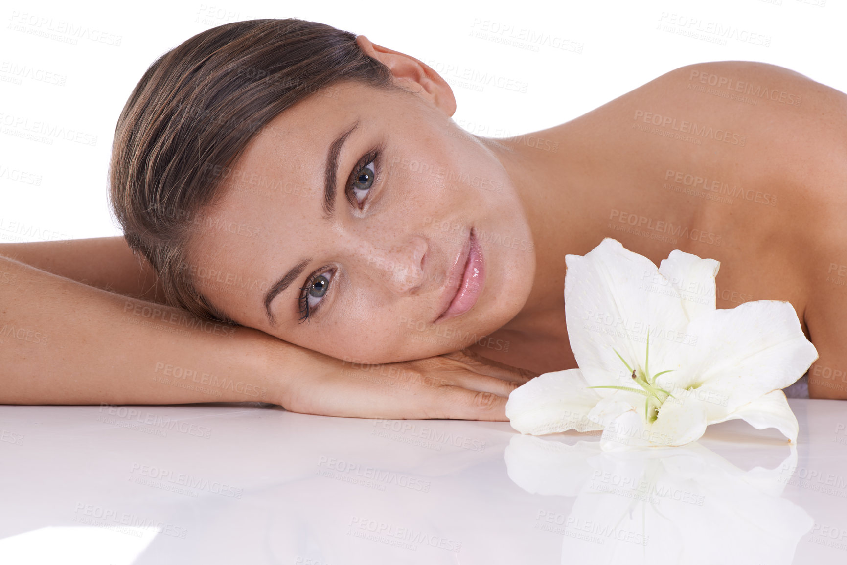 Buy stock photo Skincare, lily and portrait of woman in studio for blossom, sustainable aesthetics and pure dermatology on white background. Face, model or flowers for natural beauty, shine or eco friendly cosmetics