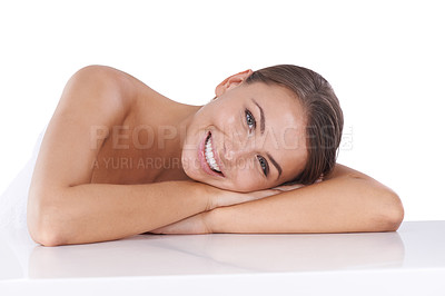 Buy stock photo Studio, table and portrait of woman with skincare in white background and happiness in beauty. Cosmetic, facial and girl with a smile for dermatology health, wellness and relax with head on arms